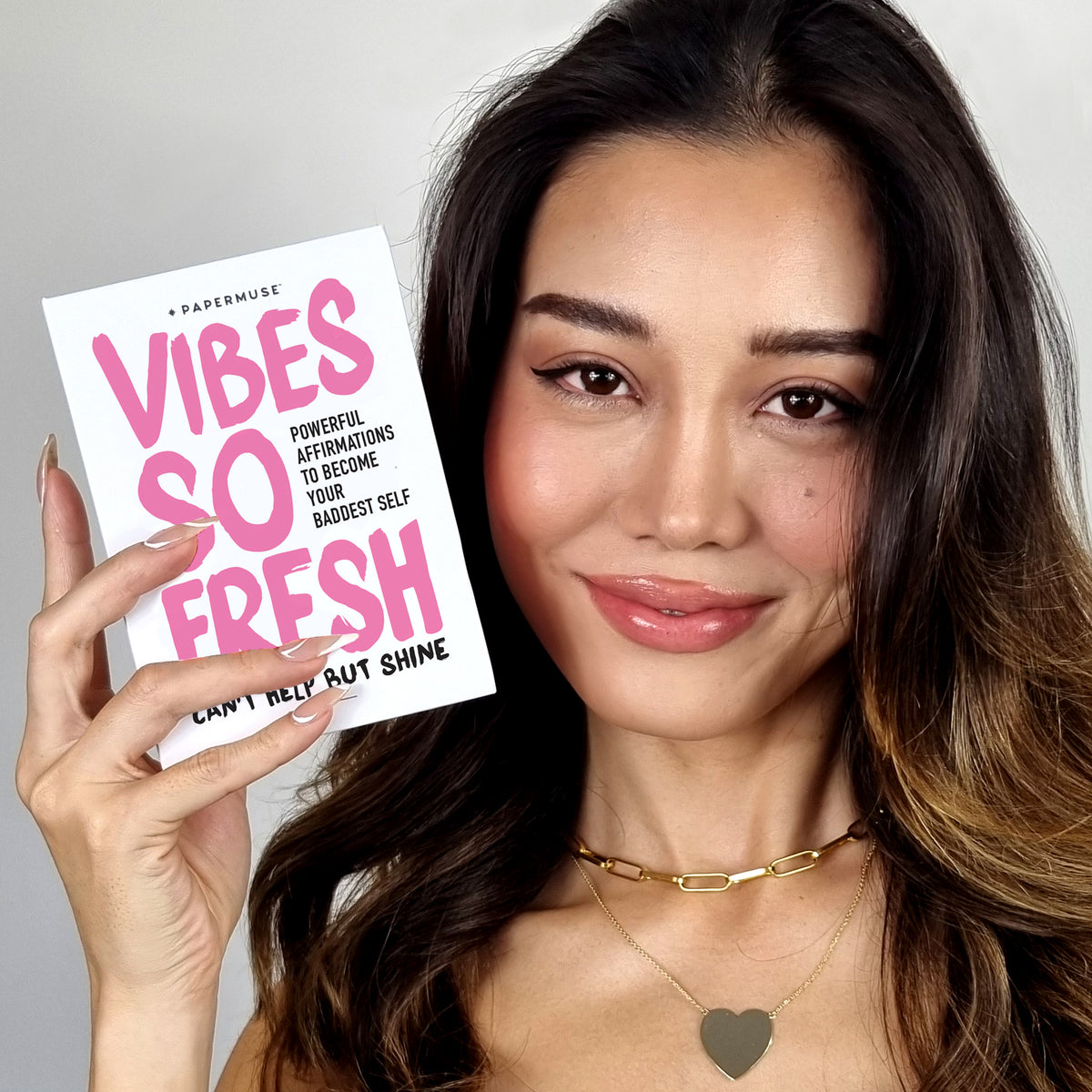 Girl holding Vibe Affirmation Card Deck